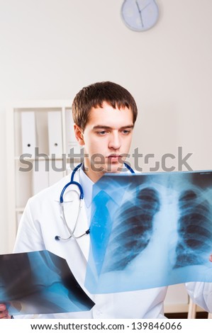 Doctor looking the x-ray picture of the chest