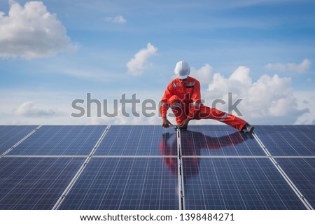 operation and maintenance in solar power plant ; engineering team working on checking and maintenance in solar power plant ,solar power plant to innovation of green energy for life Royalty-Free Stock Photo #1398484271