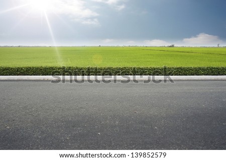 Roadside view and green grass on blue sky. Royalty-Free Stock Photo #139852579