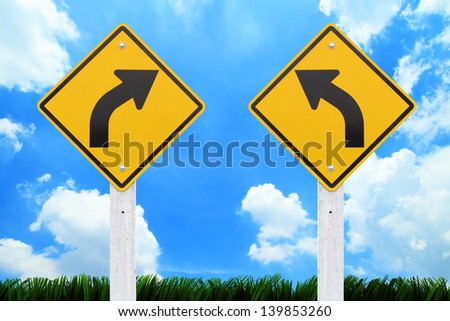 Road signs,  right or left curve on sky background. (Clipping Path Road sign)