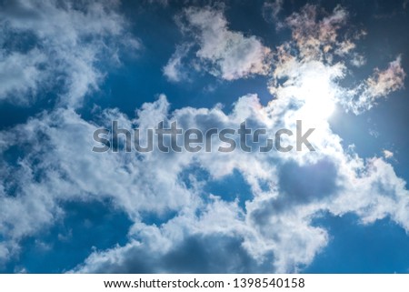 Sunbeam through the haze on blue sky , clouds with sun rays Suitable for making background images.
