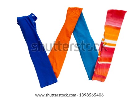 Letter W made of different colored cloth on a white background. Isolated