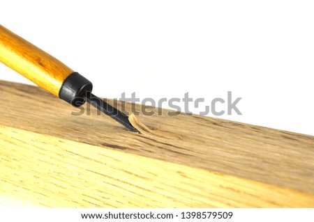 Wood carving tool on white background close up