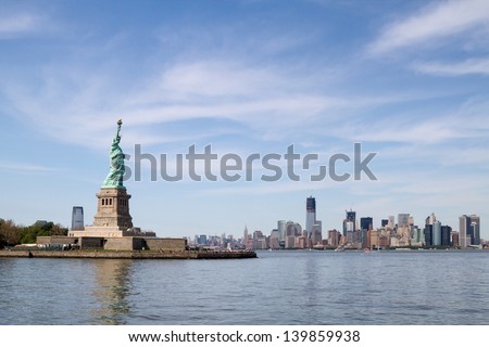 Looking at Statue of Liberty from the floating boat, with Manhattan Skyline far behind