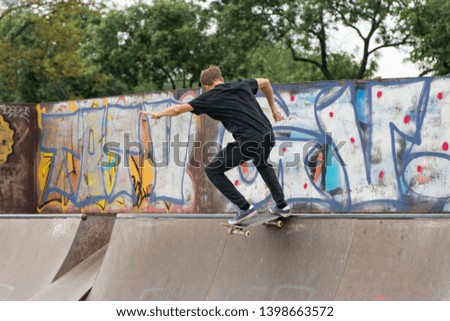 Young attractive skater in action.