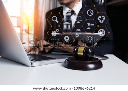 Lawyer working in office with laptop and interface icons, Legal law, advice and justice concept.