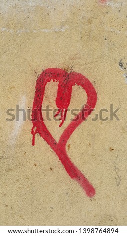 heart shape drawn with spray paint on the wall