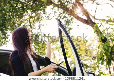 Beautiful woman drove astray into the forest. She inspected the dizzy, dazed and driving places along the map route, as determined by the GPS in the mobile phone

