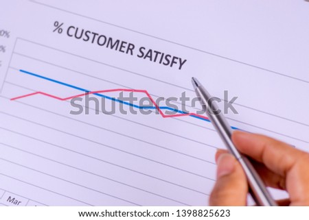 Close-up of businessman hand holding a paper document of financial report of Return on Investment, ROI. Analysing on investment risk management. Business Plan concept.