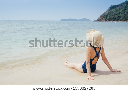 Happy bikini Woman on the beach and clouds  sky.Summer holiday concept.