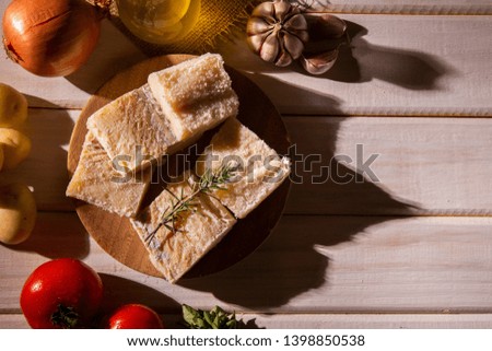 salted codfish on the wooden table with ingredients. Codfish raw.