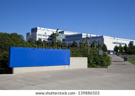 Modern hospital and sign with clear blue sky
