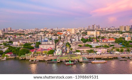 The scenery along both sides of the Chao Phraya River Consisting of waterfront communities, temples including buildings in Bangkok, Thailand