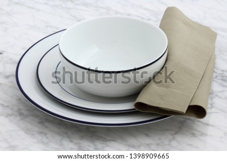 white porcelain dishes with classic blue borders an staple in Parisian bistros and brasseries