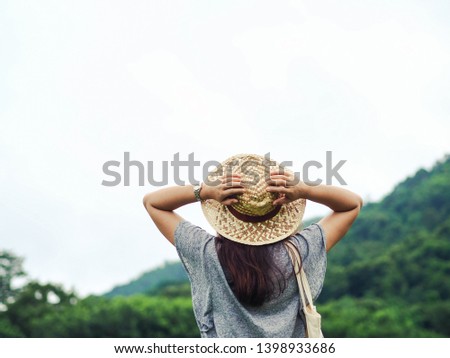 Happy young woman travel relax in the holiday. Travel hiking. Travel and wanderlust concept.