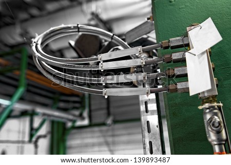 Electric wires in industrial building closeup photo
