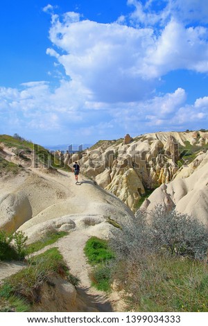 Photo taken in Turkey. The picture shows a young boy walking in the picturesque mountains of Cappadocia.