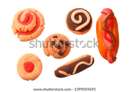 plasticine hot dog with sweets isolated on white background. modelling clay