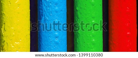 Pipes painted in colors of famous software manufacturer logo. Corporation logo concept. Red, green, blue, yellow tubes colors