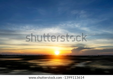 Sunset sky with silhouette of the ground.