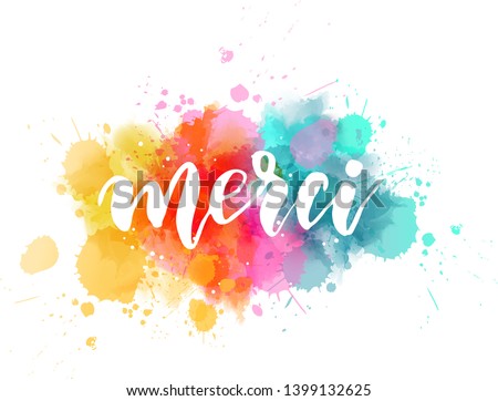 Merci - Thank you in French language. Handwritten modern calligraphy lettering text on multicolored watercolor paint splash background.
