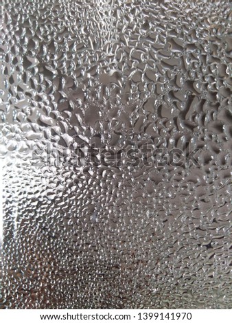 Water droplets on glass surface 
