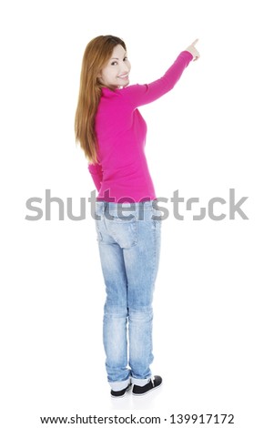 Happy , excited woman pointing on copy space, isolated on white