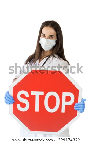 A young doctor in a white coat holding a sign "Stop", warning of unhealthy lifestyles