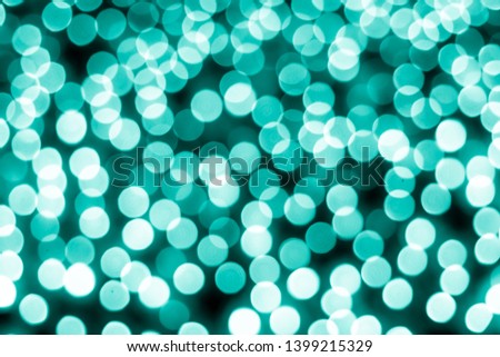 Abstract bokeh background. Soft defocused lights. Neon basic cyan color