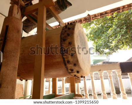 
Large and antique wooden drum in the mosque as a symbol of the tradition of past communication devices that are still awake - Picture