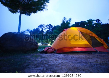 Orange tent 
Illuminate at night in the forest