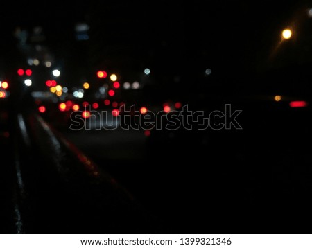  Blur image of traffic in a city at night time.