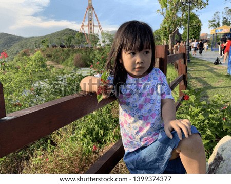 Cute baby girl posing for pictures in the park - Nha Trang, Vietnam April 16, 2019