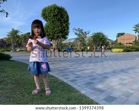 Cute baby girl posing for pictures in the park - Nha Trang, Vietnam April 16, 2019