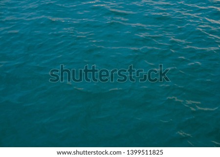beautiful texture of sea water with shallow wave, top view. thick blue-turquoise color.