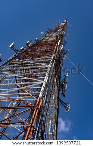 Antennae tower on a blue sky background.