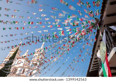 Temple of Mazamitla in the national holidays with decorated streets. Royalty-Free Stock Photo #1399542563