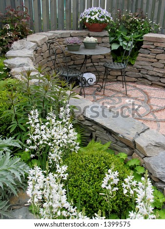 Lovely restful mosaic patio with table and chairs