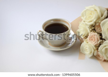 cup of coffee and wedding bouquet