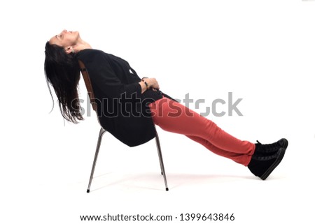 full portrait of a woman lying on a chair on white