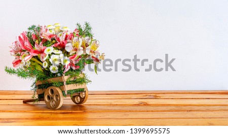 Mini Cart Flowers on Wood Table