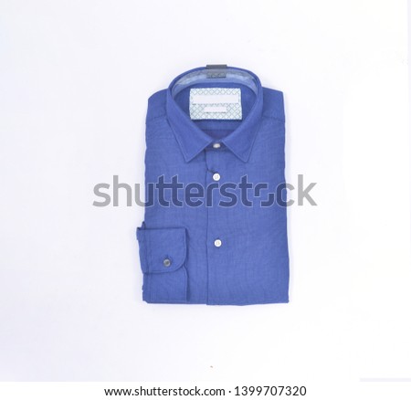 Blue folded d cotton shirt isolated on white


