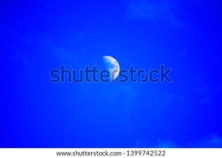 Photo of a moon in a day light