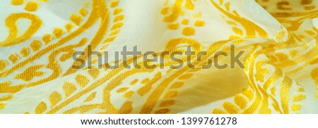 Texture, pattern, collection, silk fabric, female scarf, golden pastel on a beige background