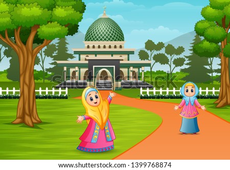 Happy muslim women posing in front of mosque
