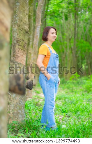 Asian woman satanding on the way in the midst of nature in Chantaburi, Thailand