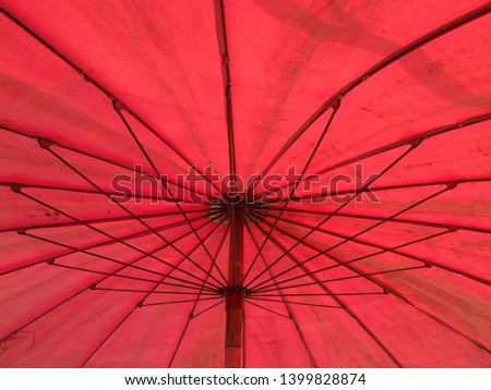 Traditional Thai umbrella from Sunday market.,abstract under big umbrella for background,vintage effect style pictures.
