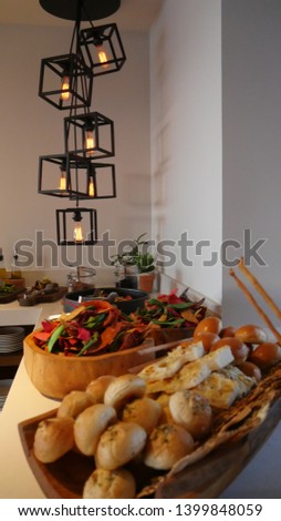 Buffet setting showing bread and tacos