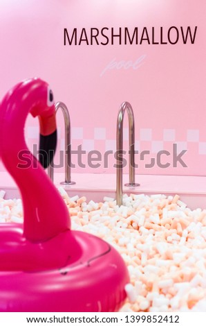 pink flamingo in the pool of marshmallows	