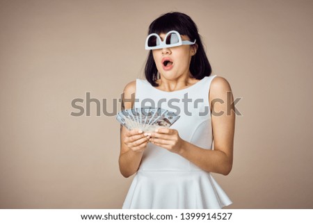   surprised woman in glasses with rich money                             